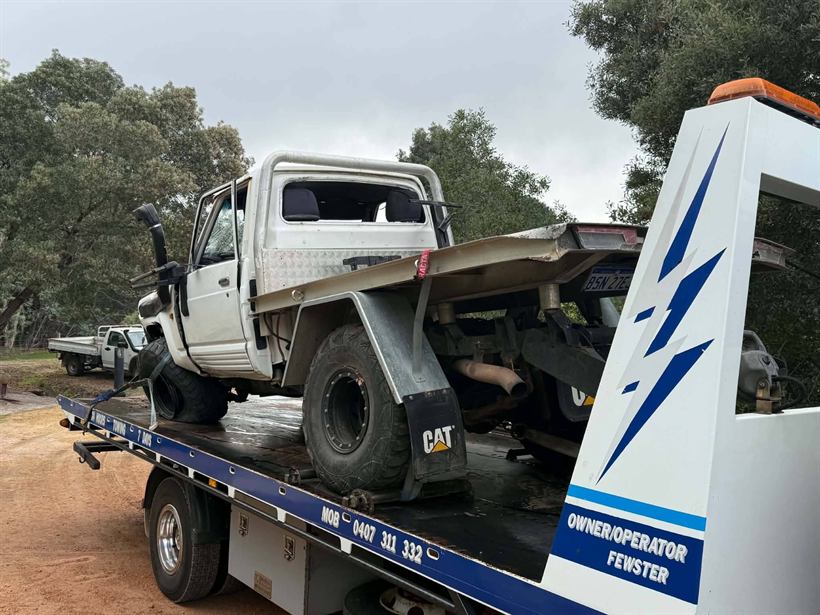 Close view of a rolled ute strapped down on the tray
