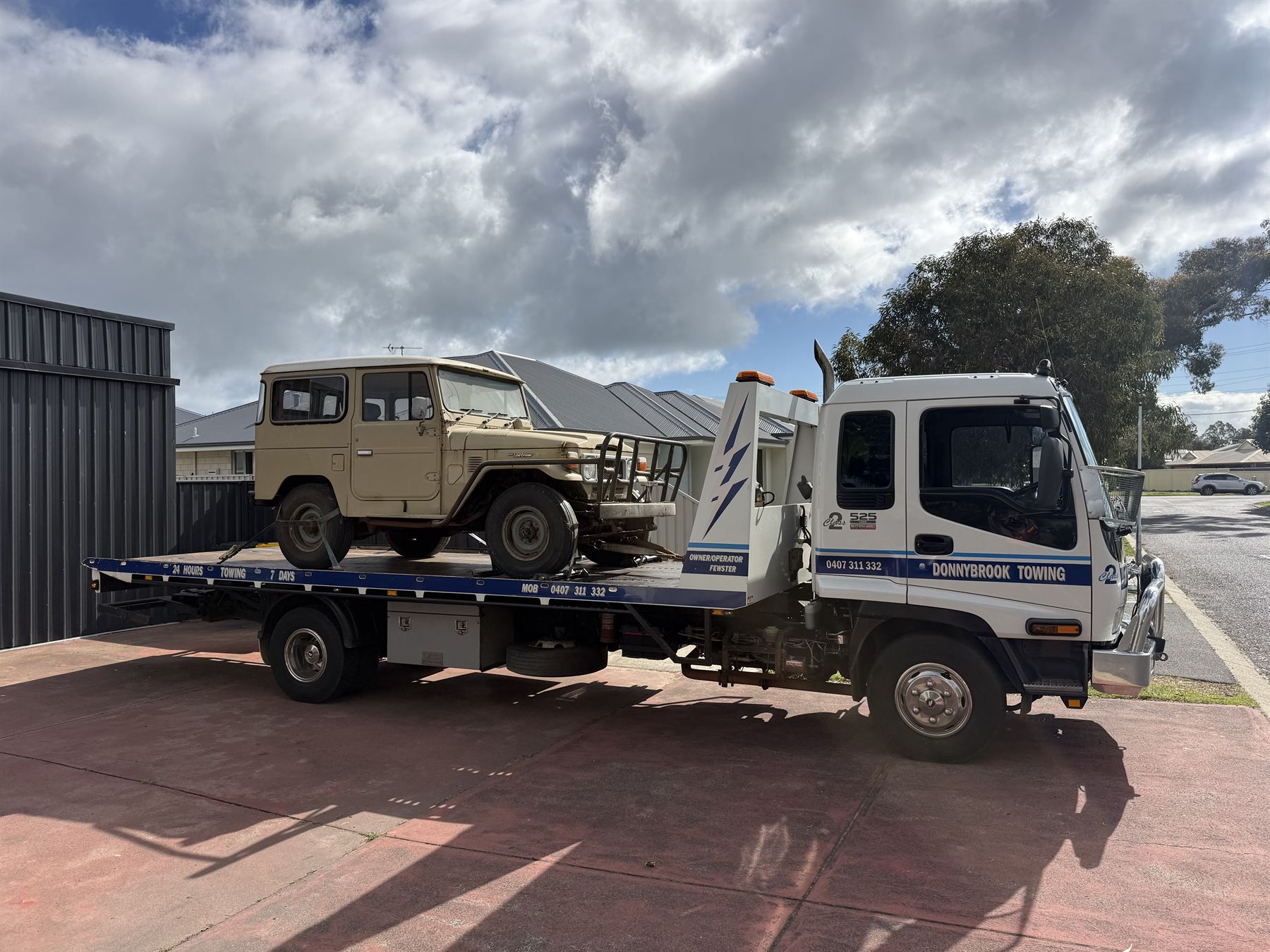 Vintage FJ40 LandCruiser strapped down on the Donnybrook Towing tilt tray